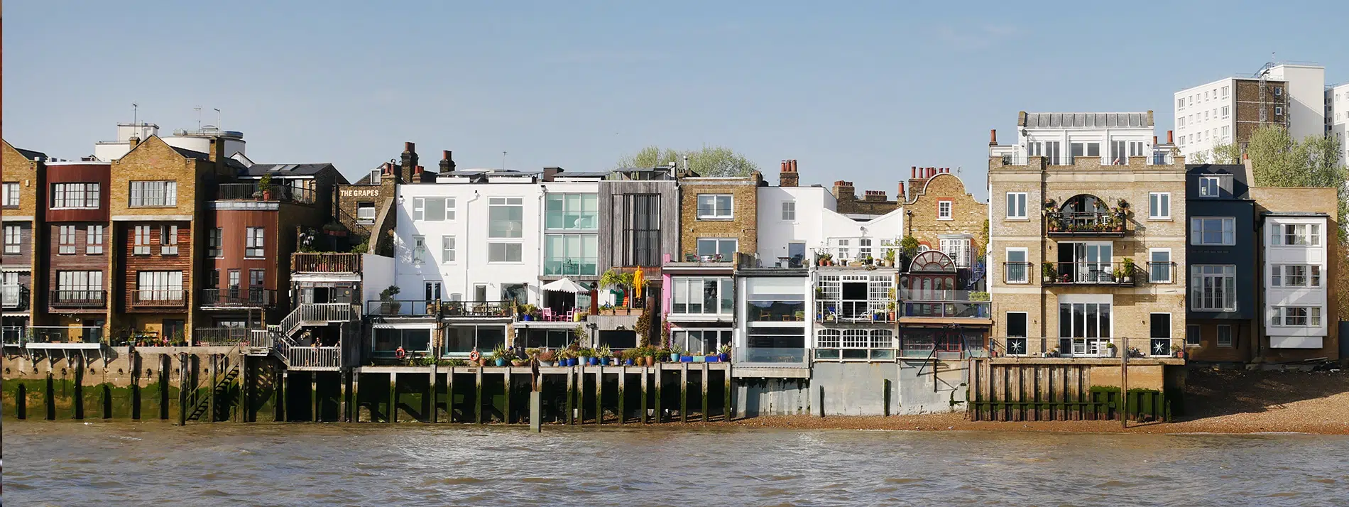 Top 10 Places to Live in the UK - houses in London on the Thames