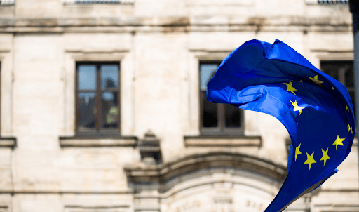 European flag waving in front of a parliament building