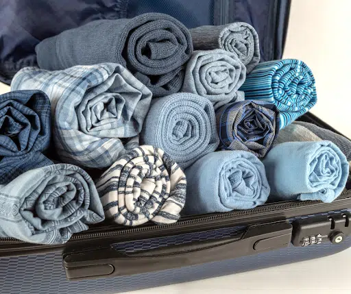Clothes that have been rolled to fit into a suitcase